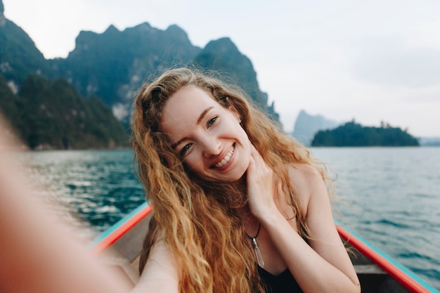 Beautiful woman posing on a boat