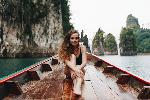 Beautiful woman posing on a boat