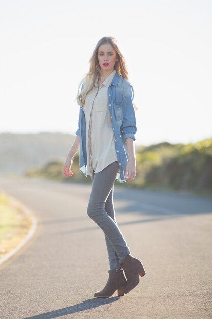 Beautiful woman posing on highway