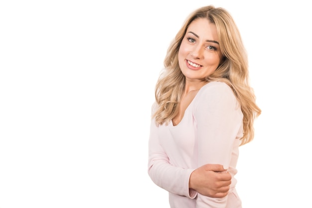 The beautiful woman posing on the white background