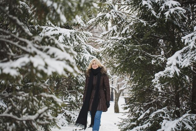 Beautiful woman posing in the wintertime in the city