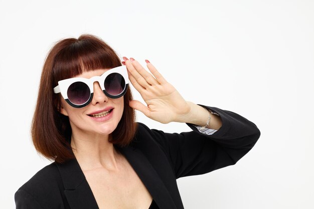 Beautiful woman posing with sunglasses a leather suit black jacket lifestyle unaltered