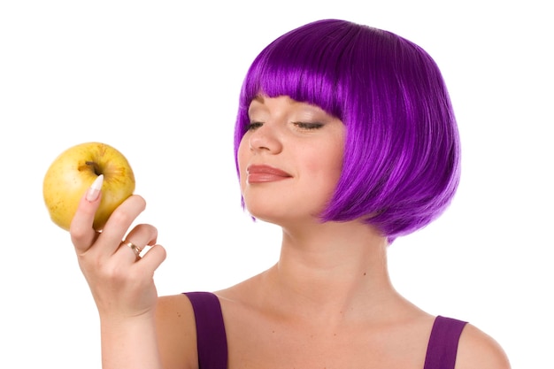 beautiful woman in purple wig and dress with yellow apple