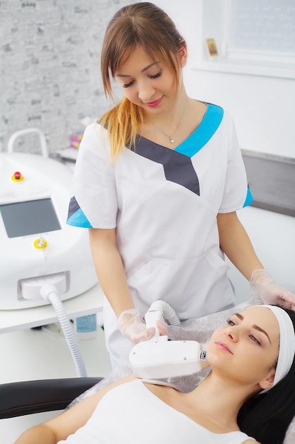 Beautiful woman receiving a laser hair removal procedure.