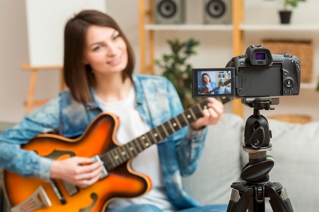 Beautiful woman recording music video