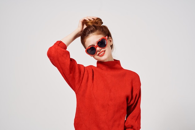 Beautiful woman in a red sweater Studio