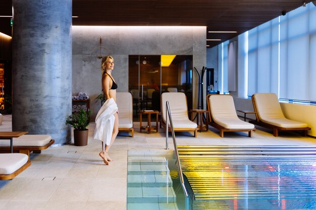 Beautiful woman relaxing in a beauty spa hotel - Client having a beauty treatment in a beauty spa salon