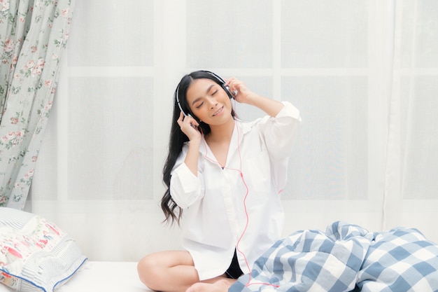 Beautiful woman relaxing listening to music.