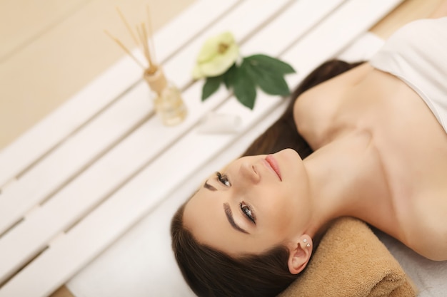 Beautiful woman relaxing in spa