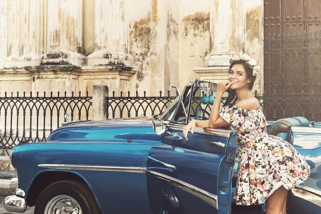 Beautiful woman and retro car