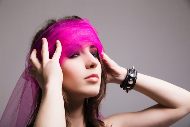 Beautiful Woman in rose blindfold