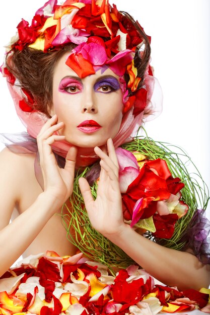 Beautiful Woman's Face and rose petals