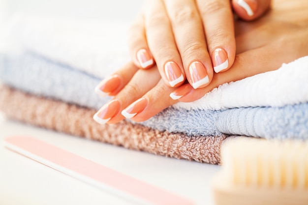 Beautiful woman's nails with french manicure