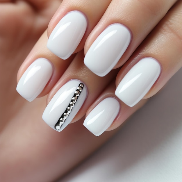 beautiful woman's white nails of hands