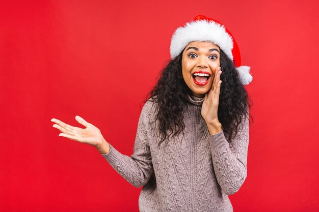 Beautiful woman in Santa Claus hat