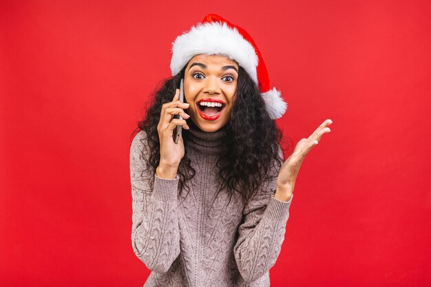 Beautiful woman in Santa Claus hat