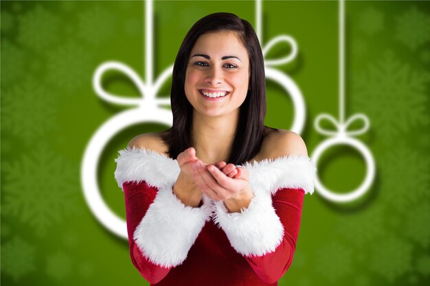 Photo beautiful woman in santa costume with hands cupped