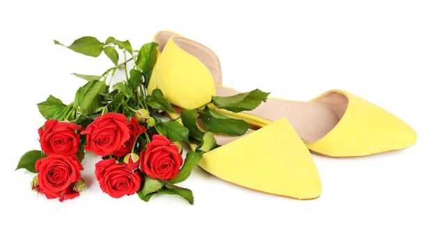 Beautiful woman shoes with flowers isolated on white