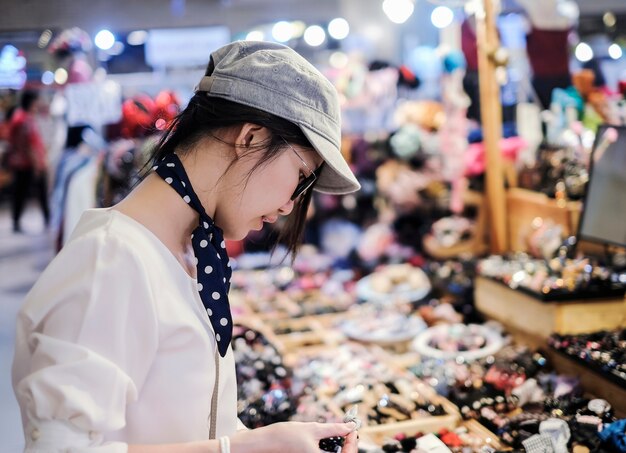 Beautiful woman shopping in festival