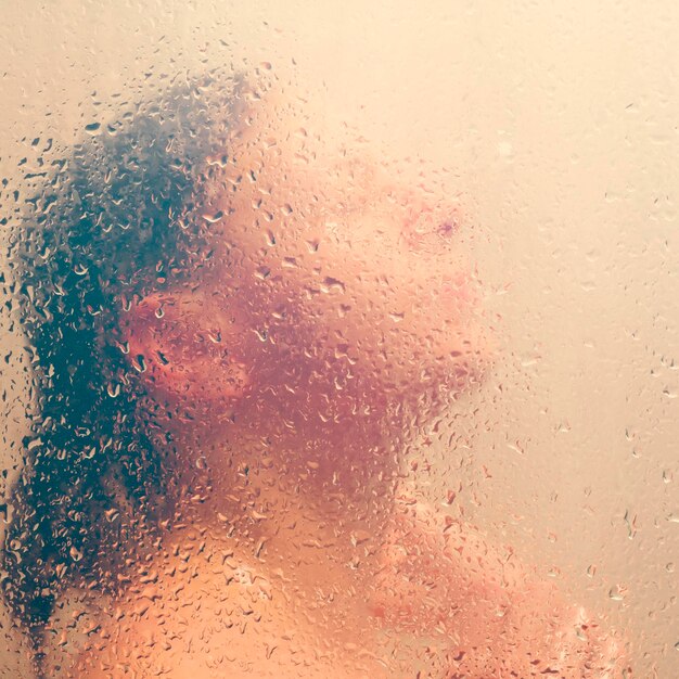 Premium Photo Beautiful Woman In The Shower Behind Glass With Drops