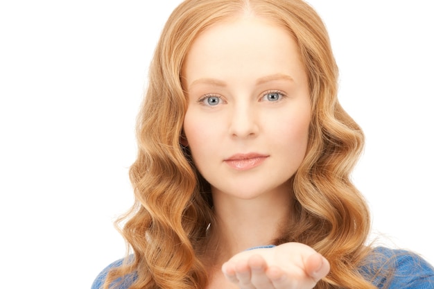 beautiful woman showing something on the palm of her hand