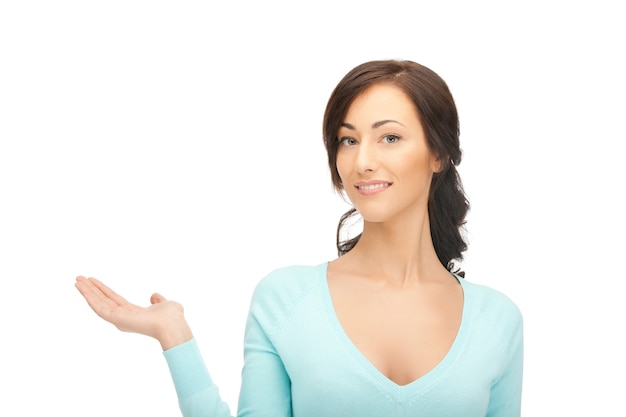 beautiful woman showing something on the palm of her hand