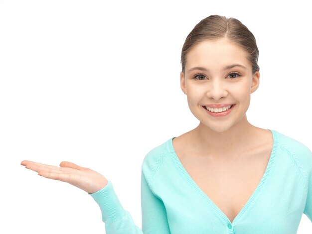 beautiful woman showing something on the palm of her hand