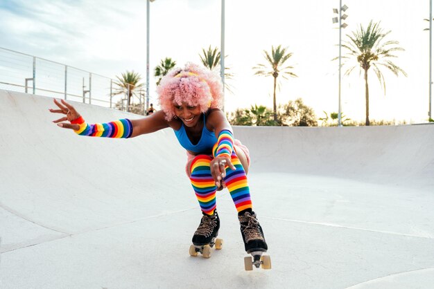 Beautiful woman skating with roller skates and having fun