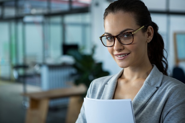 Beautiful woman smiling in office