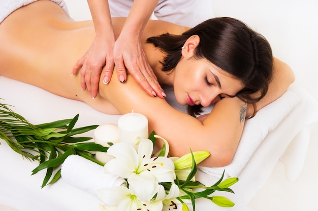 Beautiful woman in the spa salon having massage