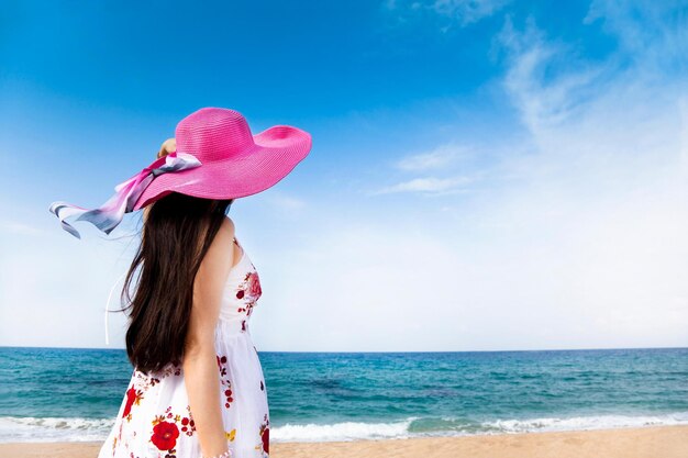 Beautiful woman standing on the beach