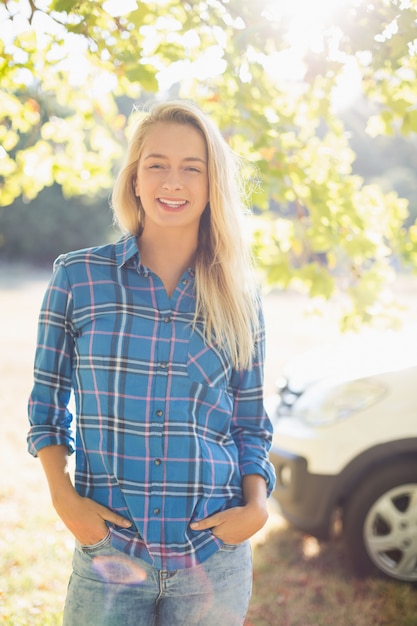 Beautiful woman standing with hands in pocket