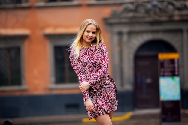 Beautiful woman on street smiling