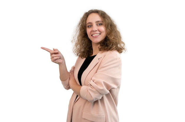 Beautiful woman in suit pointing to the side with her two hands isolated on white