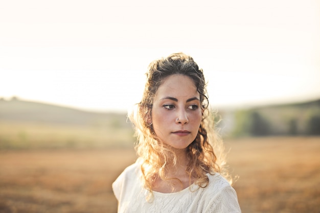 Beautiful woman in the sunset