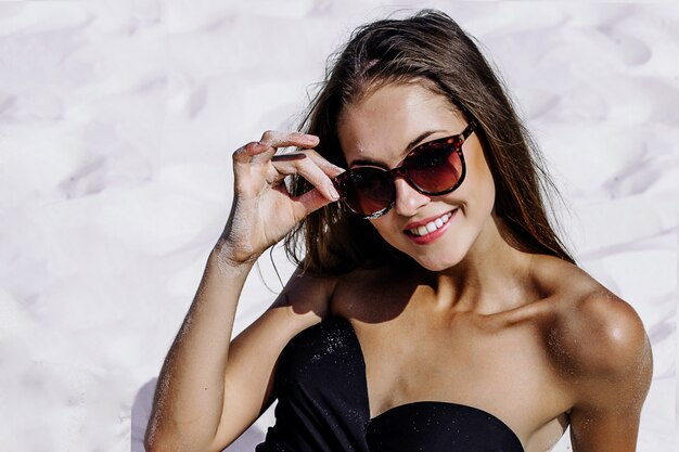 Beautiful woman in a swimsuit on the beach