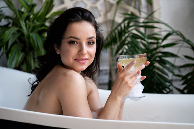 Beautiful woman taking an hot bath in her countryside house