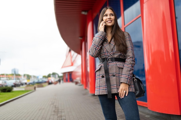 Beautiful woman talking on the phone outside