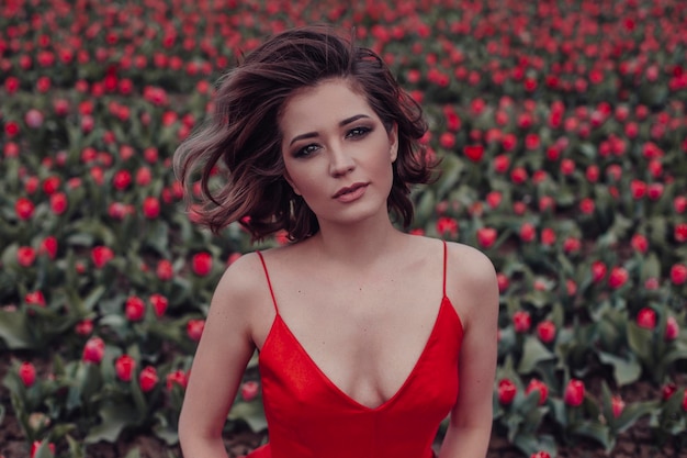 Beautiful woman in tulips field