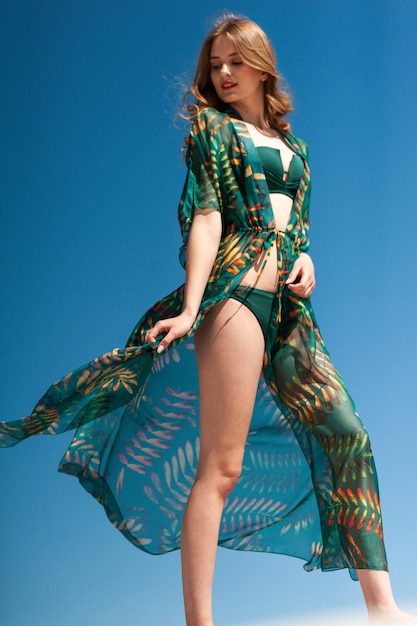 Beautiful woman wearing summer clothes on the beach