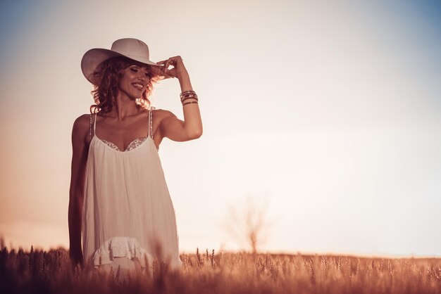 Beautiful woman in wheat field