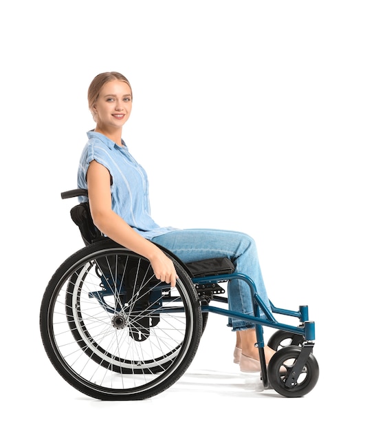 Beautiful woman in wheelchair on white