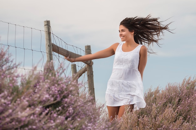 Beautiful woman on a white dress