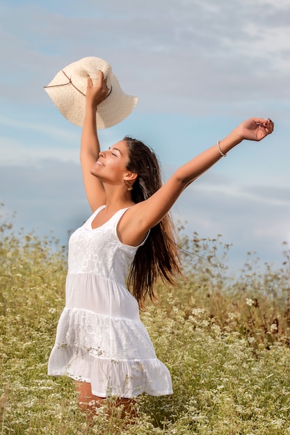 Beautiful woman on a white dress