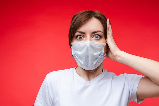 Beautiful woman in white medical mask is sick