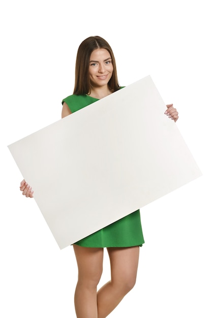 Beautiful woman and white signboard or copyspace for slogan or text, isolated over white background