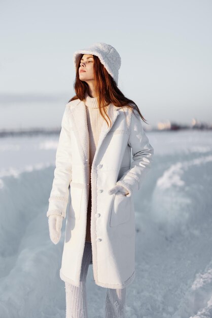 Beautiful woman winter clothes walk snow cold vacation\
lifestyle high quality photo