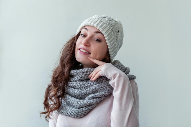 Beautiful woman winter portrait true emotions laughing girl with long hair wearing warm clothes hat ...