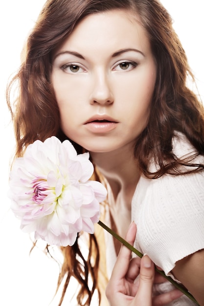 Beautiful woman with big pink flowers