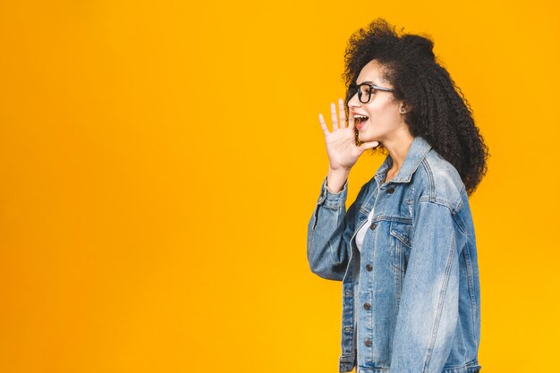 Beautiful woman with brunette curly hair and jeans jacket